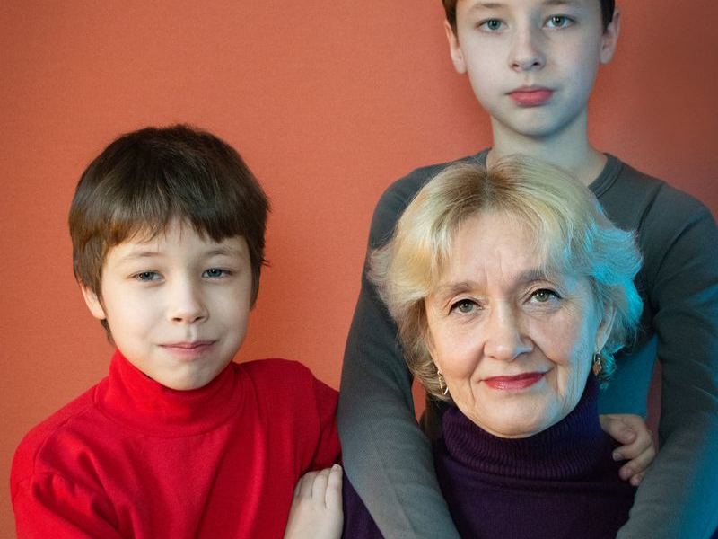 Grandmother laughing with her grandchildren